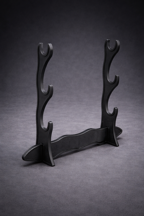 Black wooden stand with curved design on a gray background