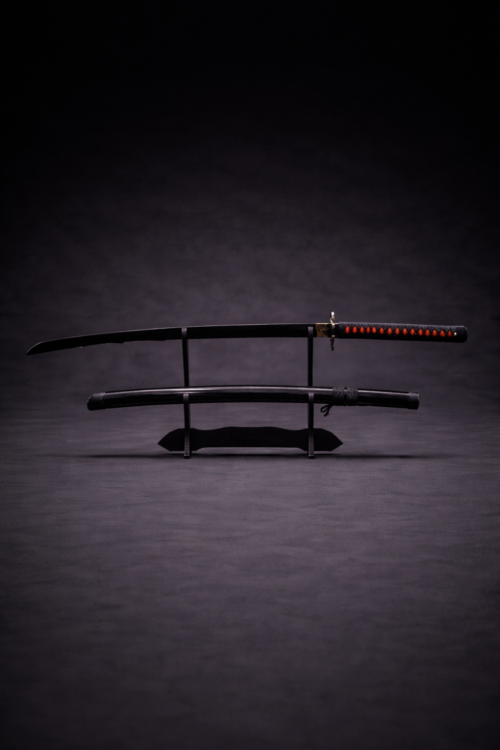 Black anime katana replica with red handle accents on display stand