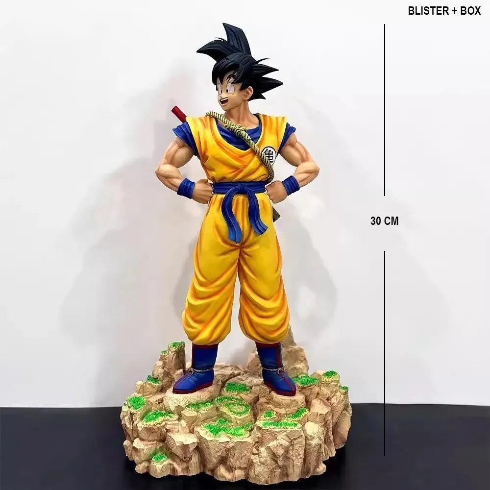 Statue of a character in yellow and blue outfit on a rock-like base with measurement details.