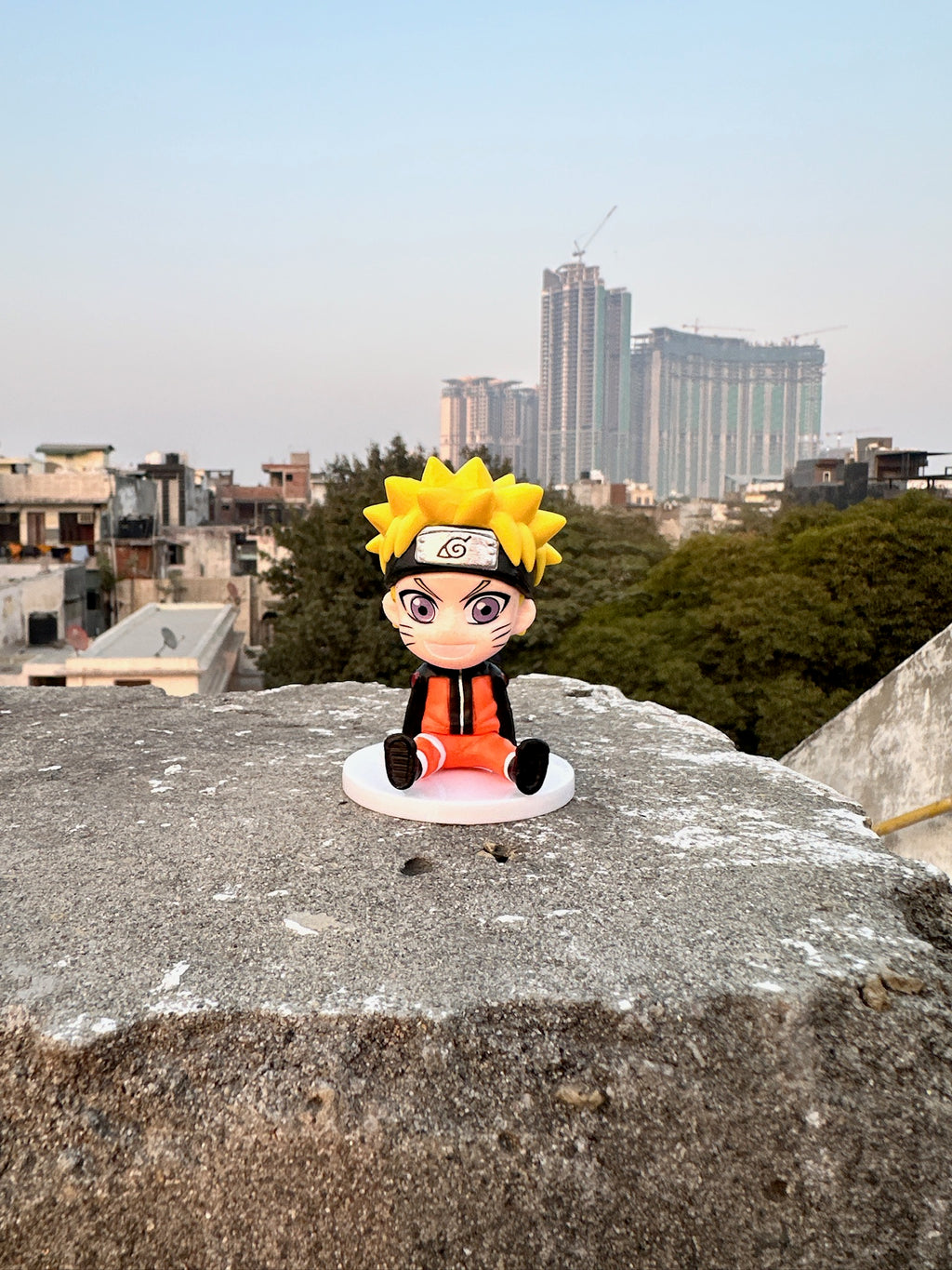 Orange Ninja (Naruto)Chibi Figurine – Mini Anime Collectible (Sitting Pose)