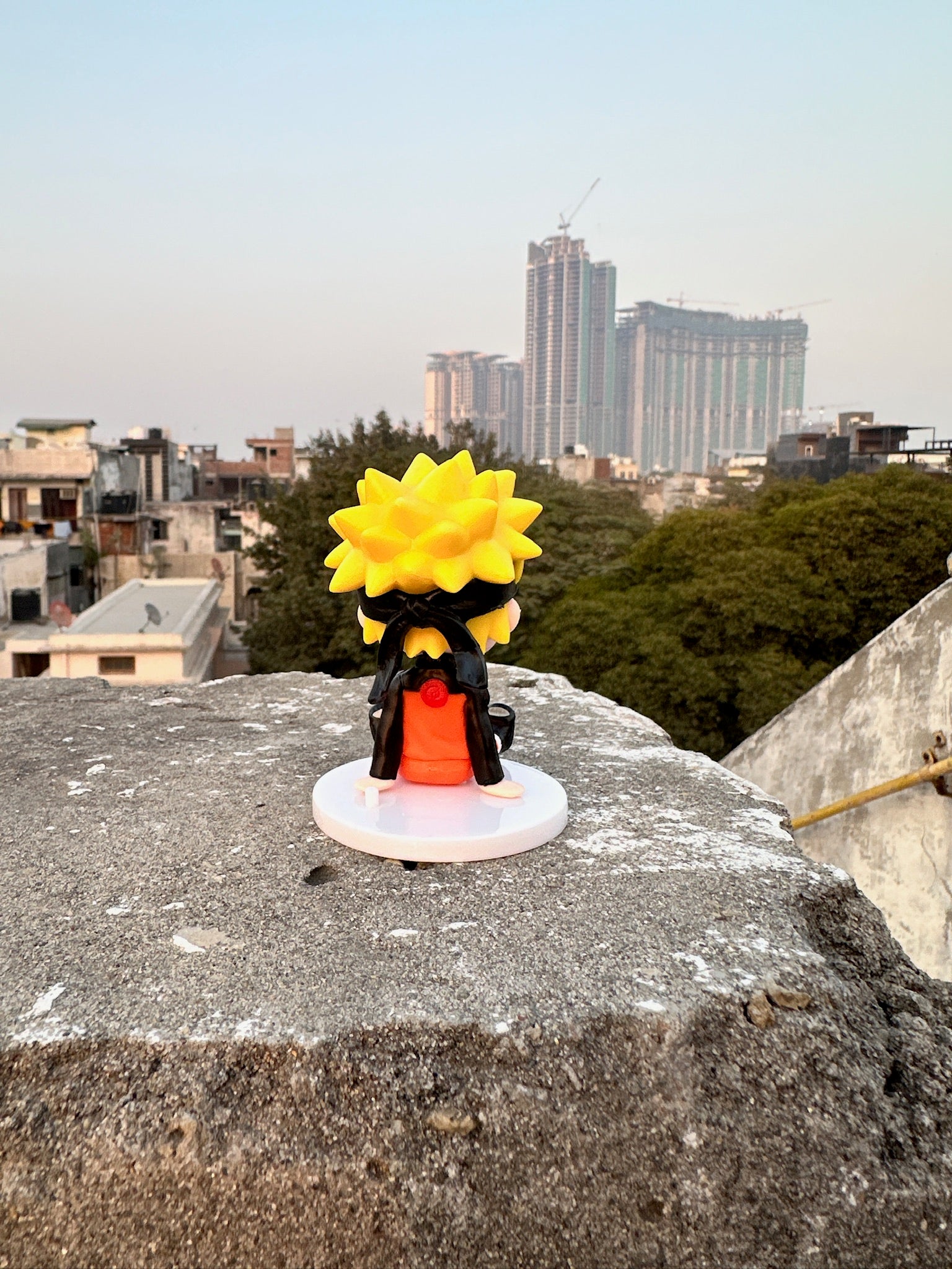 Orange Ninja (Naruto)Chibi Figurine – Mini Anime Collectible (Sitting Pose)