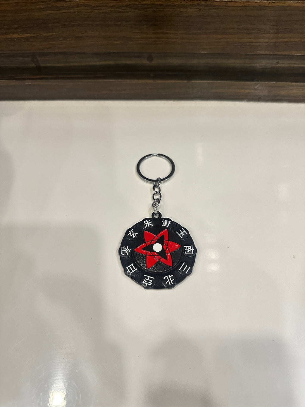 Sasuke Mangekyou Sharingan Spinner Keychain