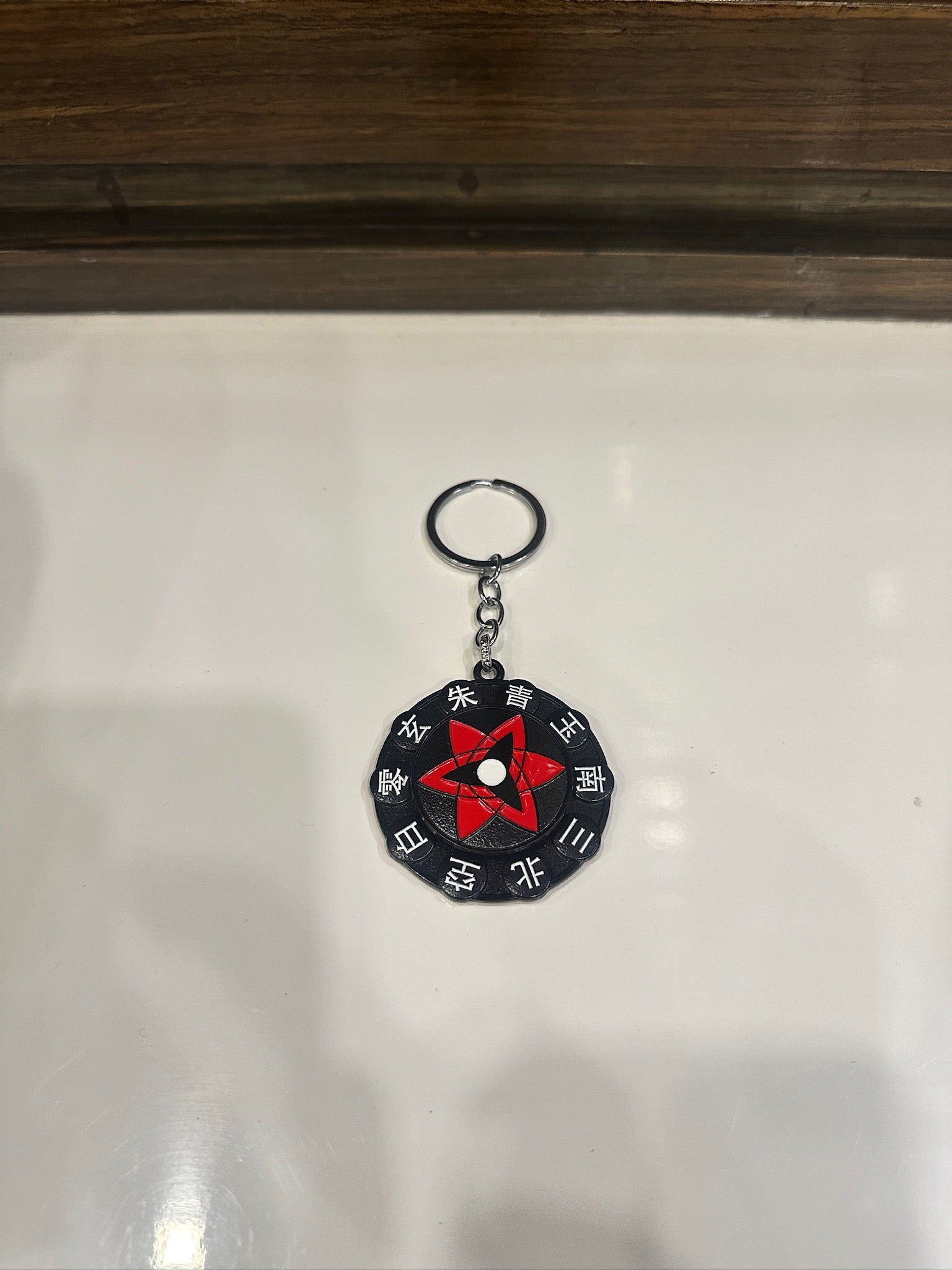 Sasuke Mangekyou Sharingan Spinner Keychain