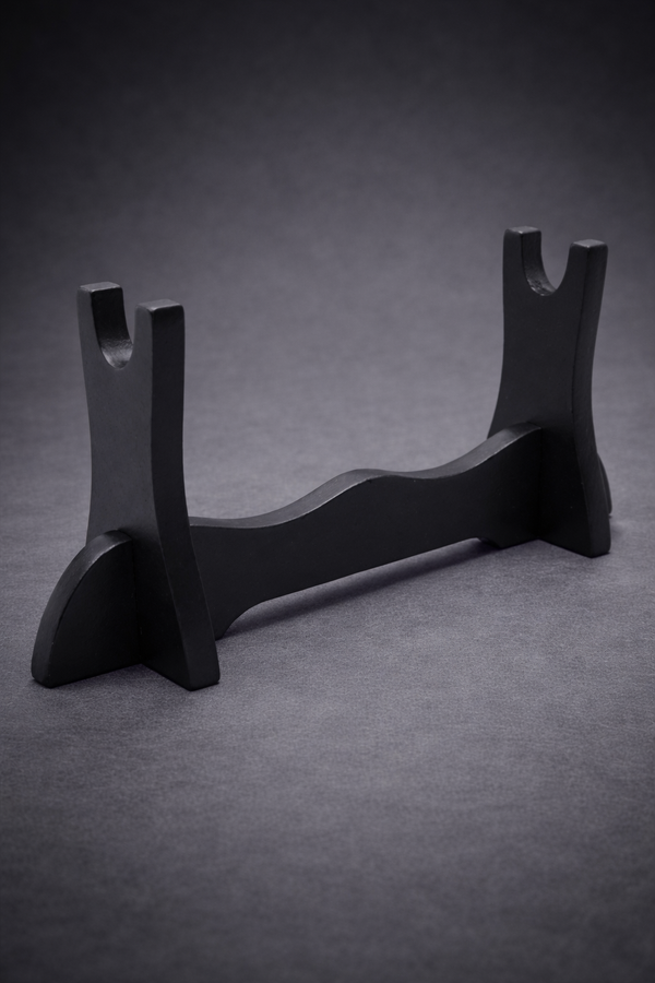 Black wooden stand on a gray background