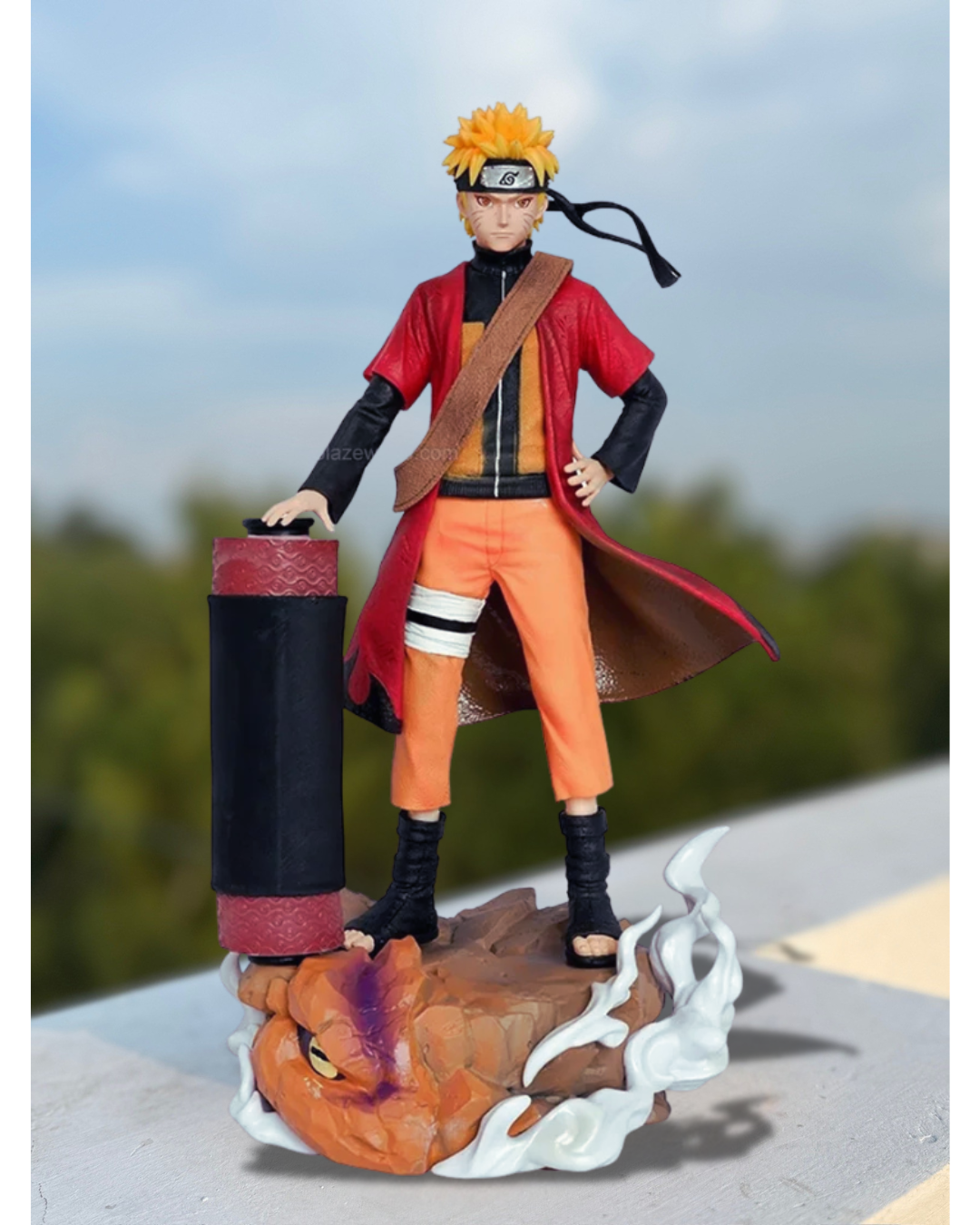 Action figure of a character from naruto anime on a stand with a blurred outdoor background.