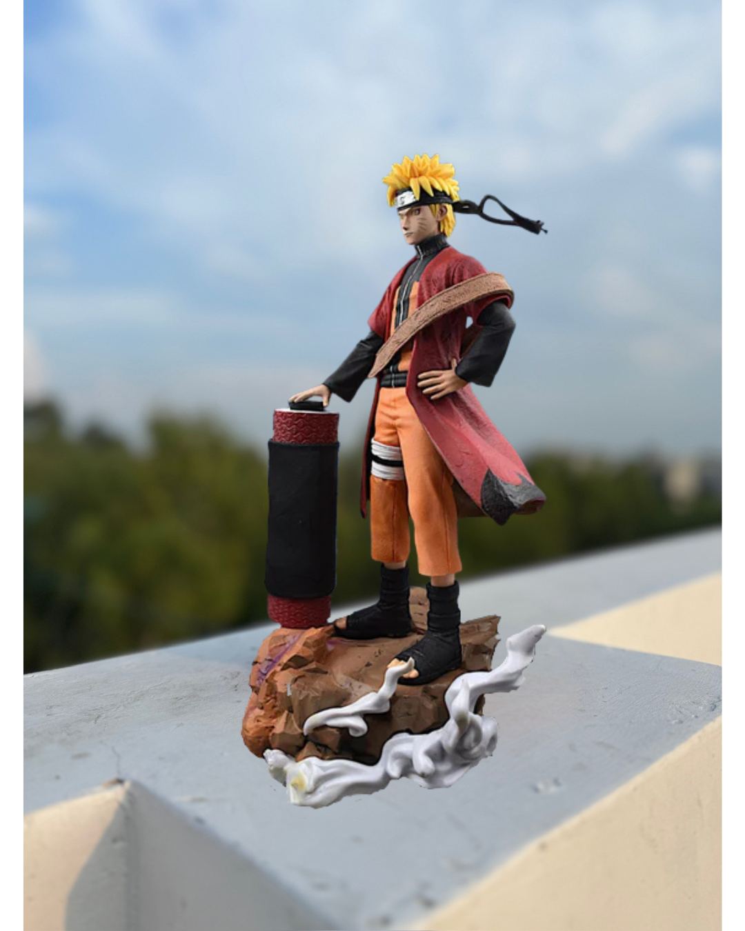Action figure of a character from a popular anime series on a rooftop with a blurred cityscape background.