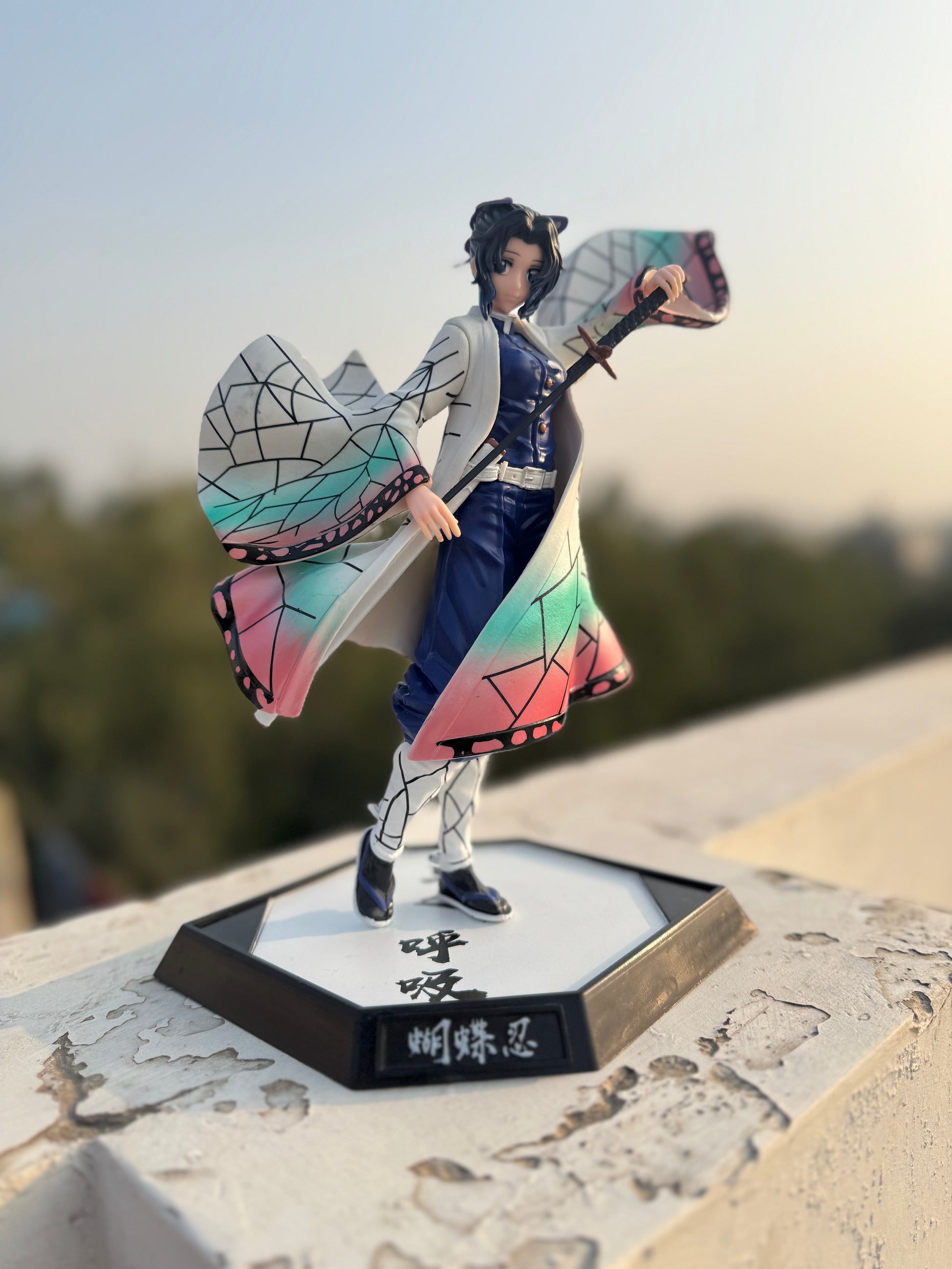 Figurine with colorful outfit on a stand outdoors