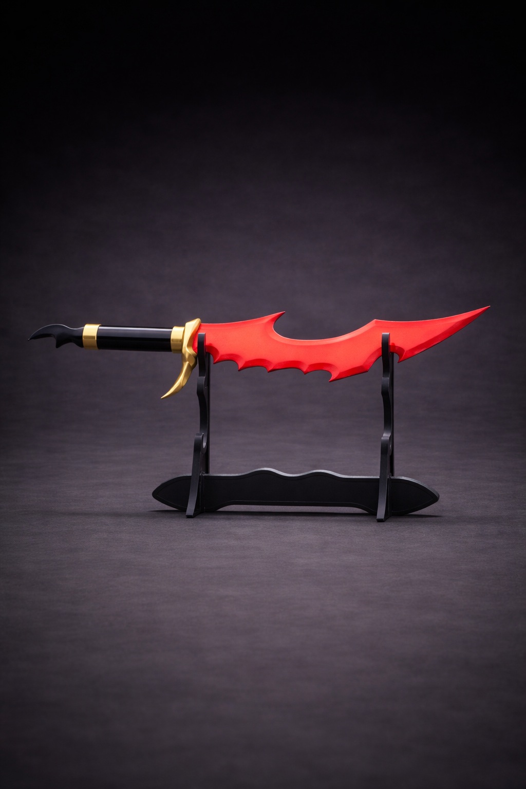 Red and black fantasy dagger on a dark background