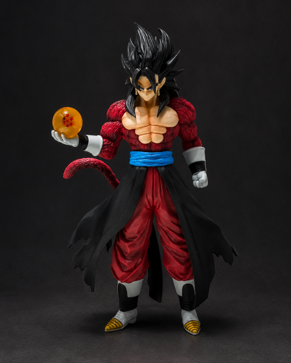 Super Saiyan Gohan action figure from Dragon Ball Z, holding a golden Dragon Ball, set against a dark studio background.