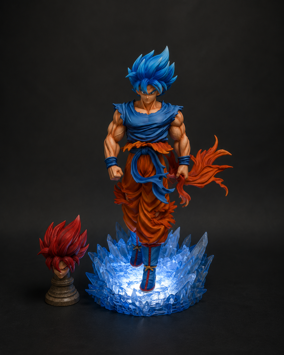 Premium Dragon Ball Super Goku 33cm anime figure featuring an LED crystal energy base, interchangeable Super Saiyan Blue and Super Saiyan God heads, detailed PVC construction, and collector-quality finish.